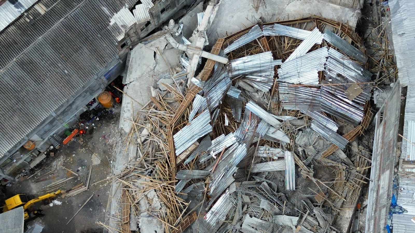 Three dead and dozens feared still trapped after school building collapses | World News